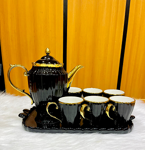 Classic luxury tea set, consisting of one teapot, six cups, and one tray. 
