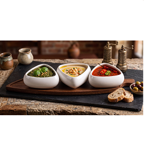  Serving Set 3-Piece of white porcelain bowls with an attractive, sleek triangular design, arranged on a natural wooden base with a distinctive elongated style.