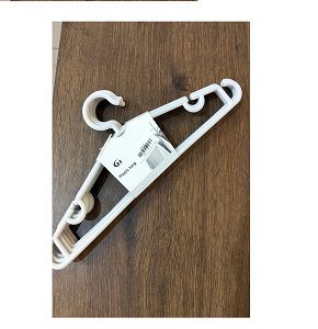 Set of innovative beige plastic clothes hangers 

