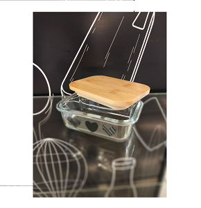 Small rectangular glass refrigerator container with heart-decorated lid 
