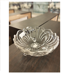 Living Home glass fruit plate, made of heavy transparent glass with intricate crystal engravings, resting on three carved glass legs


