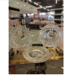 Living Home glass serving plate set, 4 pieces, elegant round design with classic embossed diamond-like patterns that reflect light luxuriously. Perfect for serving or as a stylish decorative piece in 