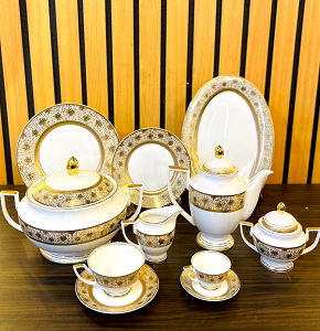Weimar 111-Piece Dinner Set, crafted from premium porcelain, adorned with luxurious gold decorations and finely detailed accents.
