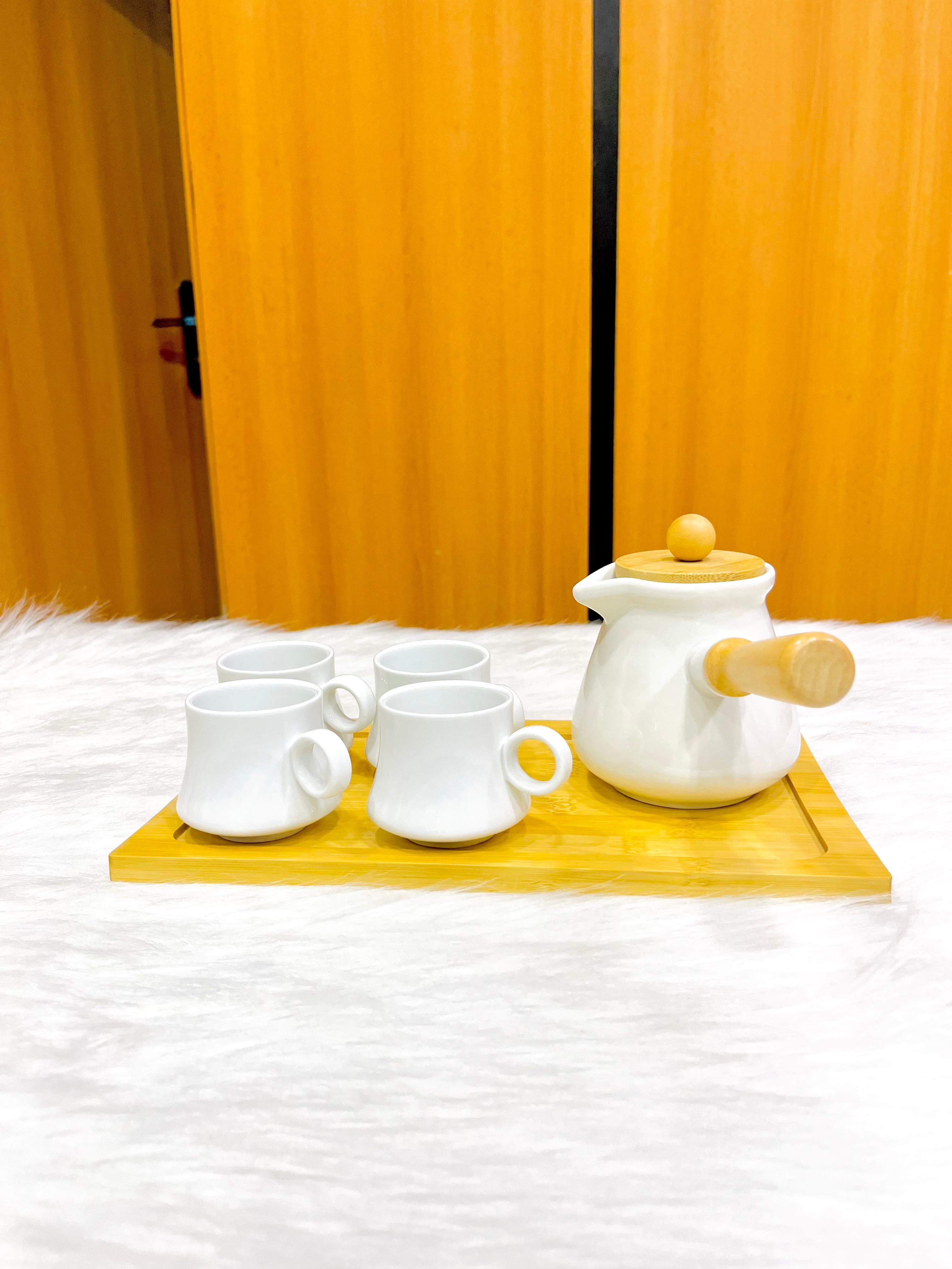 Porcelain coffee set consisting of porcelain coffee pot with 4 porcelain mugs and wooden tray 
