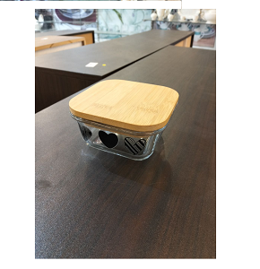 Small square glass refrigerator container with heart-decorated lid 
