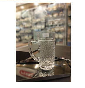 Living Home glass jug, thick with a carved texture

