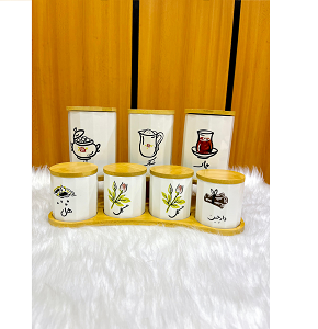 Set of 7-piece porcelain spice jars with white porcelain design and Persian art on wooden base 
