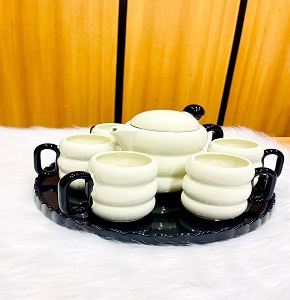 Modern porcelain tea set, consisting of one teapot + 6 cups + one tray
