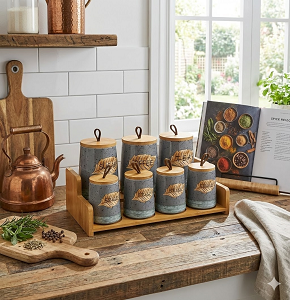 Set of 7-piece porcelain spice jars with stone gray coating and embossed leaf patterns equipped with wooden lids with modern leather handles and matching wooden tray