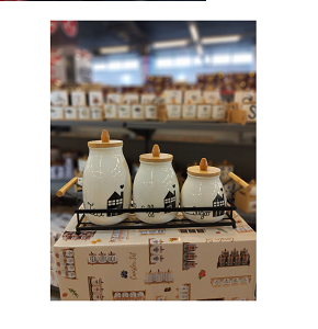 Set of 3-piece porcelain sugar jars for kitchen white porcelain with home drawings and wooden lids inside elegant metal basket combining organization and beauty 
