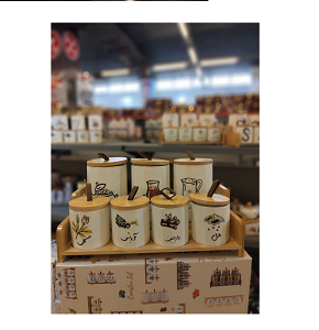 Set of 7-piece porcelain spice jars in different sizes equipped with tight wooden lids and elegant wooden display base 
