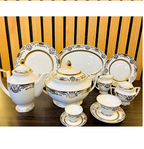 Weimar 111-Piece Dinner Set, made of high-quality porcelain, inspired by silver and gold arabesque motifs resembling lace, with a delicate inner rim.
