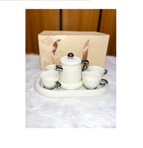 Luxury porcelain tea set, consisting of one teapot, four cups, and one tray
