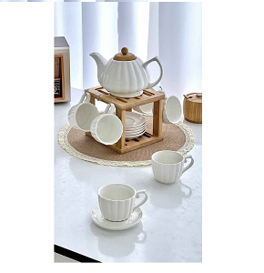 Porcelain tea set consisting of teapot plus 6 white ceramic cups with 6 wooden coasters and versatile wooden holder 
