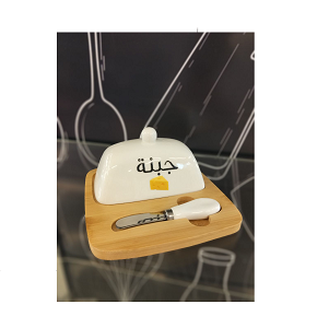 Cheese serving box with a wooden base, white porcelain lid, and matching porcelain-handled knife