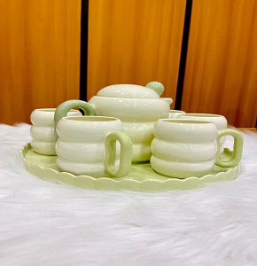 Modern porcelain tea set, consisting of one teapot, 6 cups, and one tray

