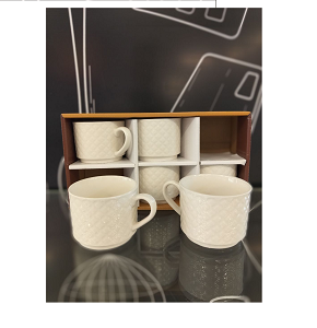 Set of white porcelain mugs with soft circular line design 
